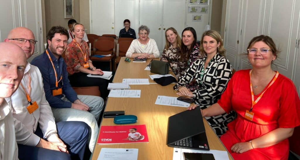 Ashley Dalton MP pictures top, centre of the photo in white top, with officers from the APPG on Babies and representatives from the National Children's Bureau and the Parent-Infant Foundation